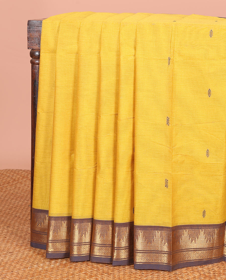 Yellow Chettinad Cotton Saree Subtly Made with Thread Buttas All Over Its Body, Complemented by a Contrast Traditional Zari Temple Border, and a Pallu of Stripes and Buttas