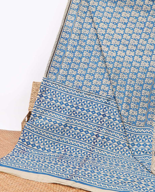Blue floral design machine-printed kalamkari cotton saree with contrast border & geometric design pallu