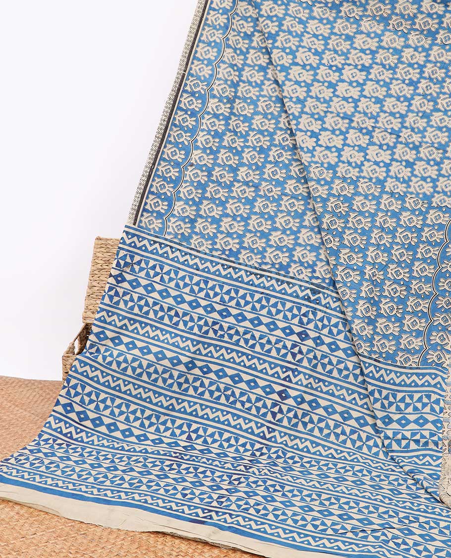 Blue floral design machine-printed kalamkari cotton saree with contrast border & geometric design pallu