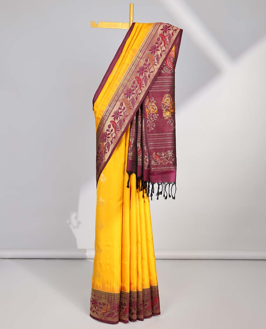 Yellow soft silk sarree with contrast floral zari border & intricatr zari design pallu