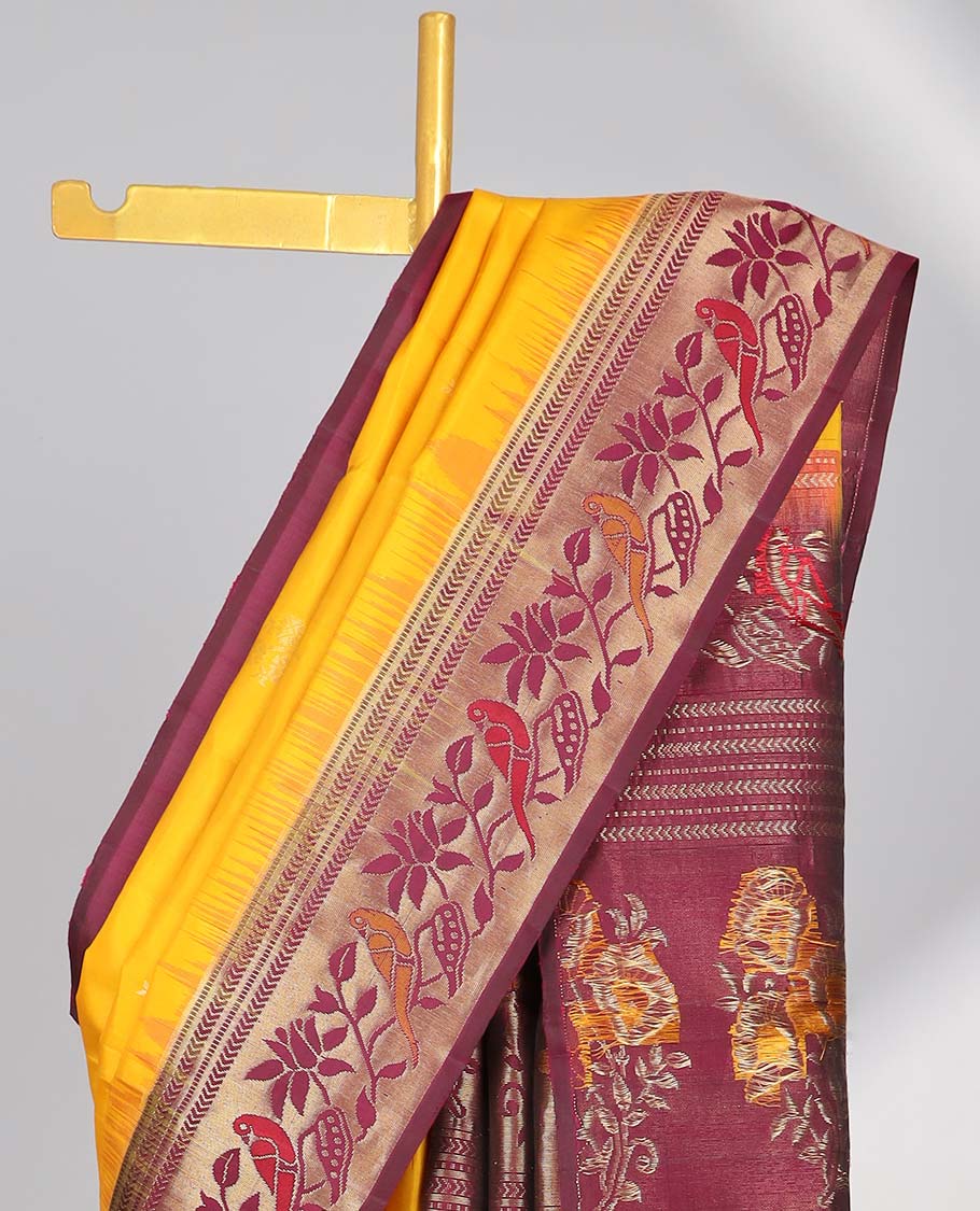 Yellow soft silk sarree with contrast floral zari border & intricatr zari design pallu