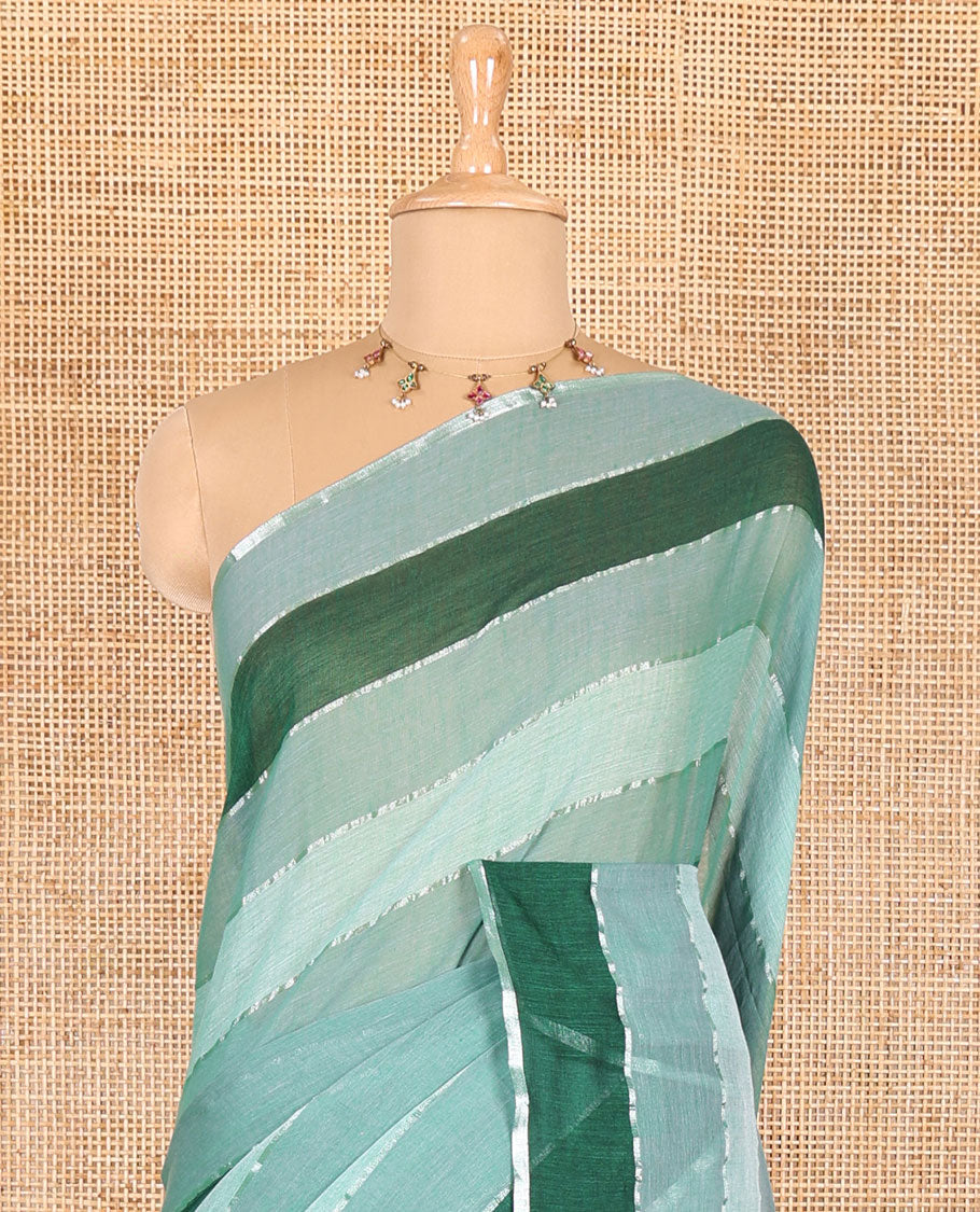 Light green ombre-colored striped khadi mul cotton saree, zari piping border, striped pallu, and a matching striped blouse