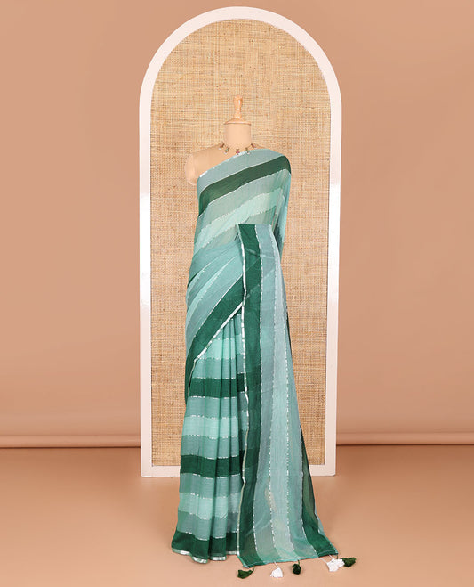 Light green ombre-colored striped khadi mul cotton saree, zari piping border, striped pallu, and a matching striped blouse