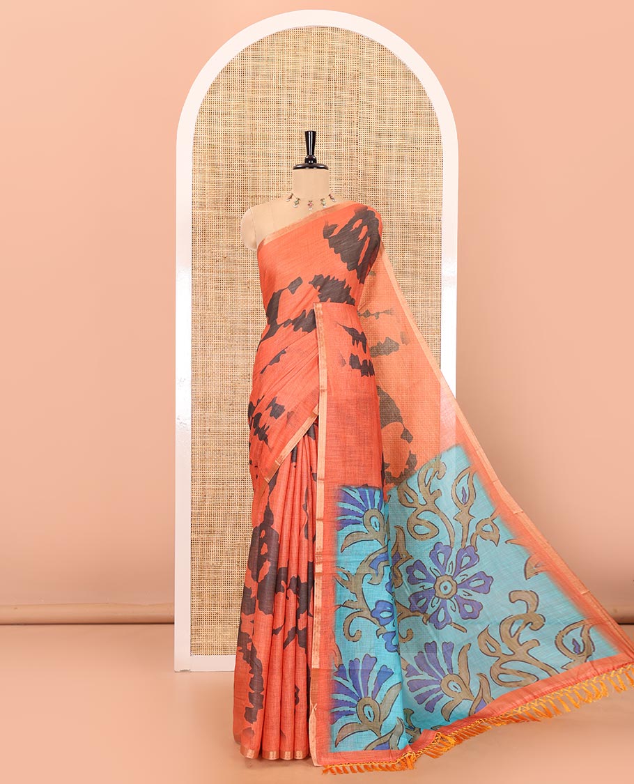 Orange shibori printed linen cotton saree, piping border, contrast floral printed pallu, and a contrast floral printed blouse