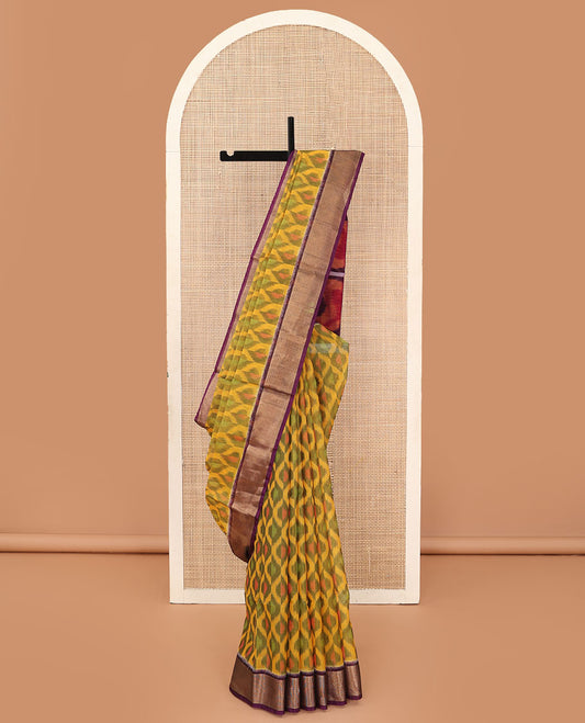 Yellow ikkat ogee patterned silk cotton saree, contrast zari bavanji border, and pallu of paisleys and checks