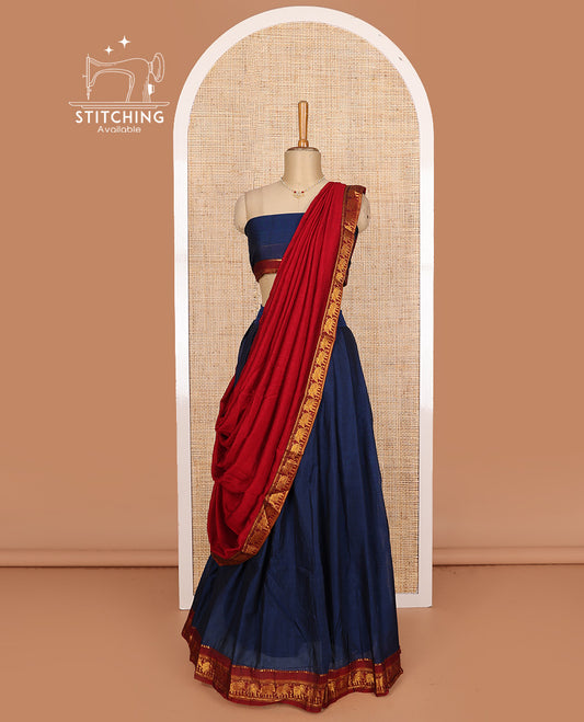 Blue cotton half-saree, plain with contrast elephant motif bordered skirt, matching blouse, and contrast elephant motif bordered dhavani