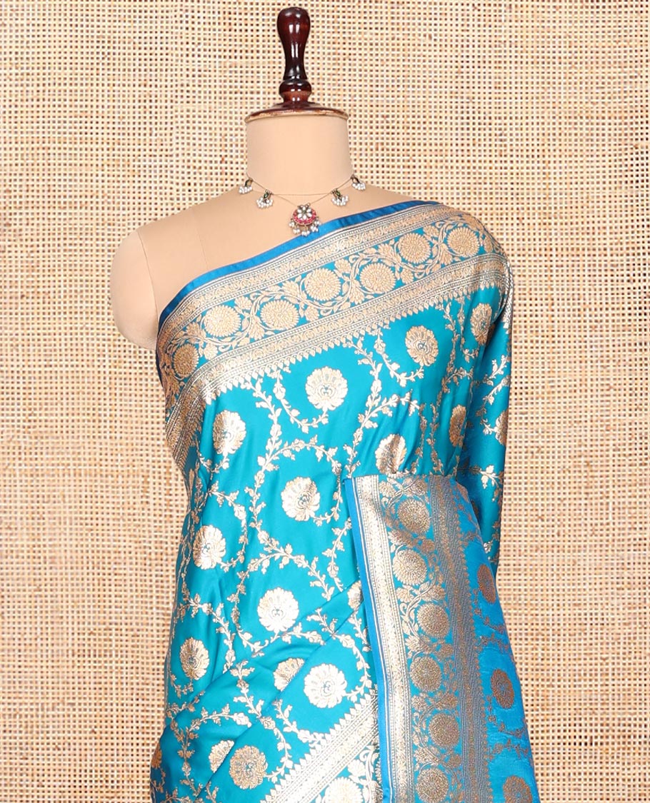 Blue Banarasi Nylon Saree, Highlighted by Floral Jacquard, Floral Creeper Zari Border, Intricate Pallu, and a Matching Blouse
