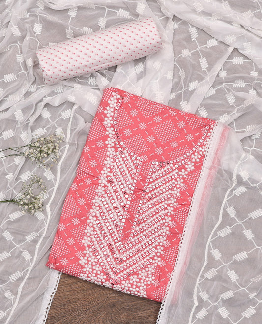 Pink Material Chudidar Set, Adorned with Jaal-Pattern Print and Neck Embroidery on Rayon Top, a Contrast Polka Dot Printed Bottom, and Paired with Embroidered Chiffon Dupatta