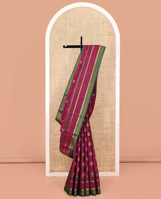 Maroon Vasundhara Lite Silk Mix Saree, Decked Up with Zari Buttas All Over Its Body, Complemented by Contrast Varisai Pettu Zari Border, Grandly Decked Up Pallu, and Paired with a Contrast Blouse