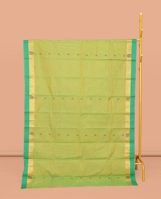 Green Kanchi Cotton Saree, Mesmerized with Buttas All Over Its Body, Complemented by a Contrast Border of Floral Designs, Pallu of Intricate Designs, and Paired with a Matching Blouse