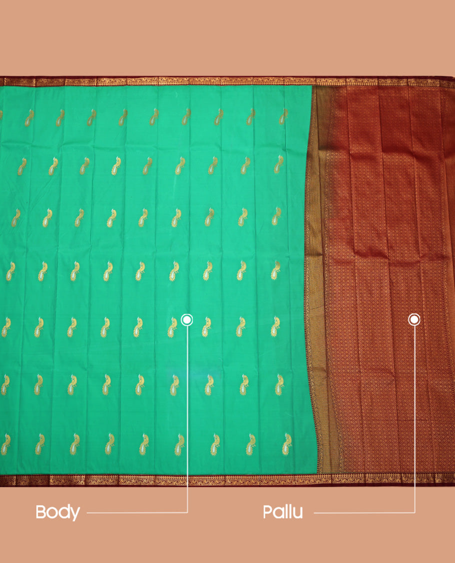 Green Budget Silk Saree, Mesmerized with Peacock Buttas, Complemented by a Contrast Paisley Vine Zari Border, Grand Pallu, and Contrast Blouse