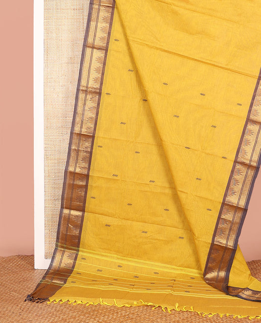 Yellow Chettinad Cotton Saree Subtly Made with Thread Buttas All Over Its Body, Complemented by a Contrast Traditional Zari Temple Border, and a Pallu of Stripes and Buttas