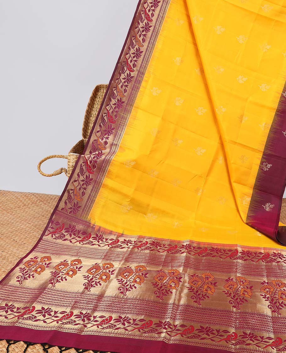 Yellow soft silk sarree with contrast floral zari border & intricatr zari design pallu