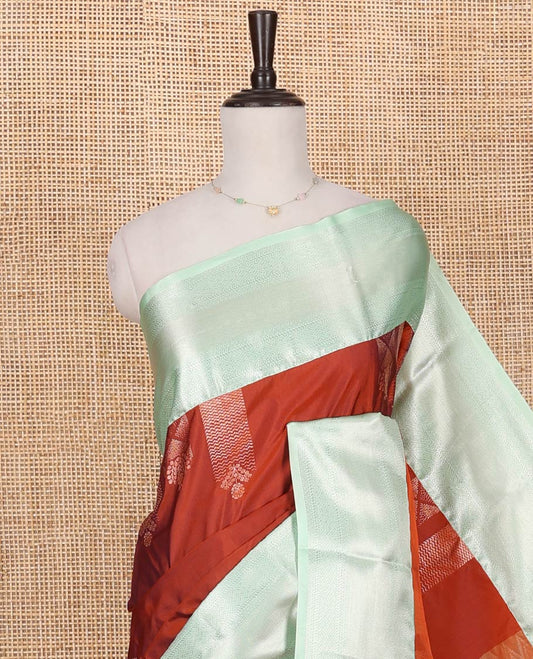 Rust Budget Silk Saree, Elevated with Zari Buttas on Its Body, Complemented by a Contrast Traditional Zari Design Border, Chevron Design Pallu, and Paired with a Contrast Blouse