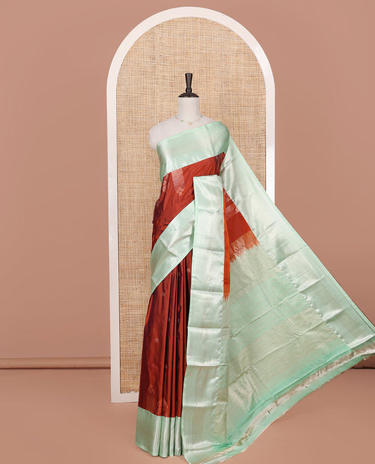 Rust Budget Silk Saree, Elevated with Zari Buttas on Its Body, Complemented by a Contrast Traditional Zari Design Border, Chevron Design Pallu, and Paired with a Contrast Blouse
