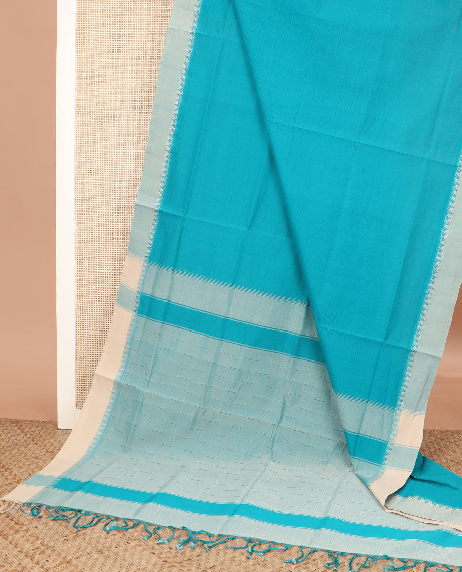 Sky blue checked Andhra cotton saree, contrast temple border, and pallu of buttas