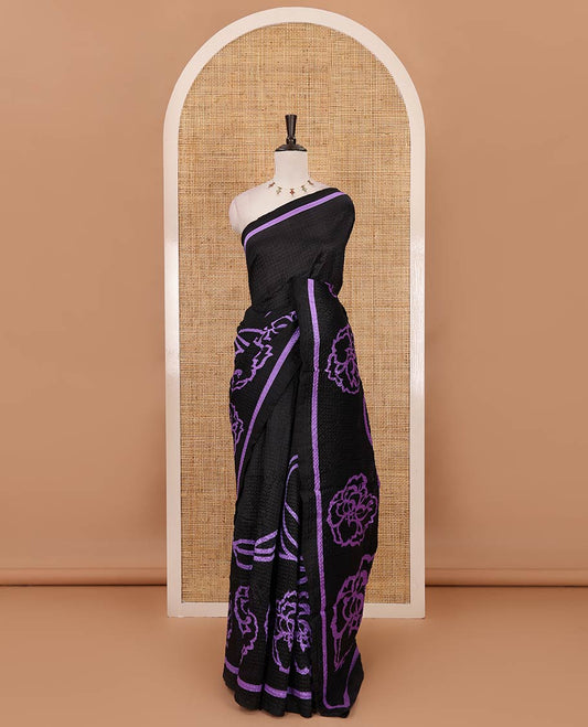 Black-base crushed litchi saree features fancy violet color floral printed body, printed piping border & pallu