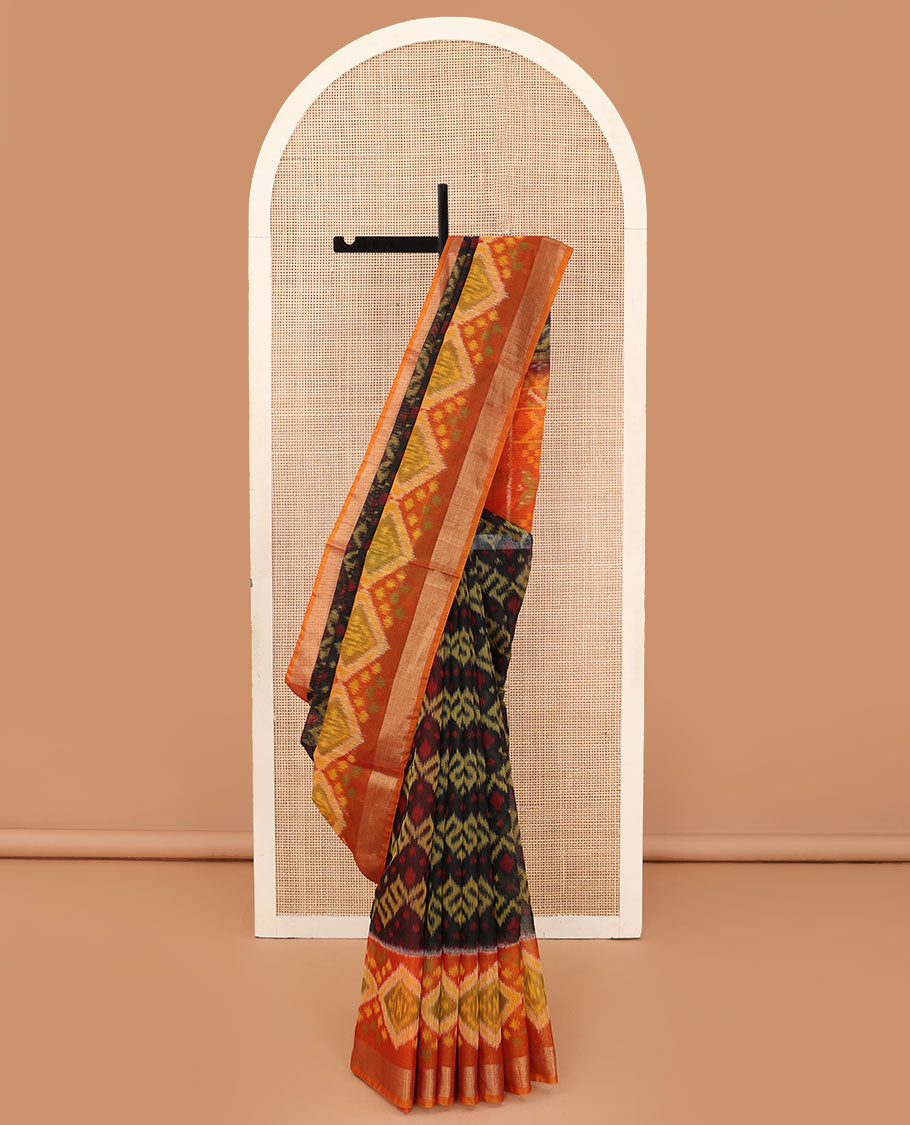 Black ikkat chevron design silk cotton saree, contrast diamond ikkat patterned border, and pallu of ikkat designs
