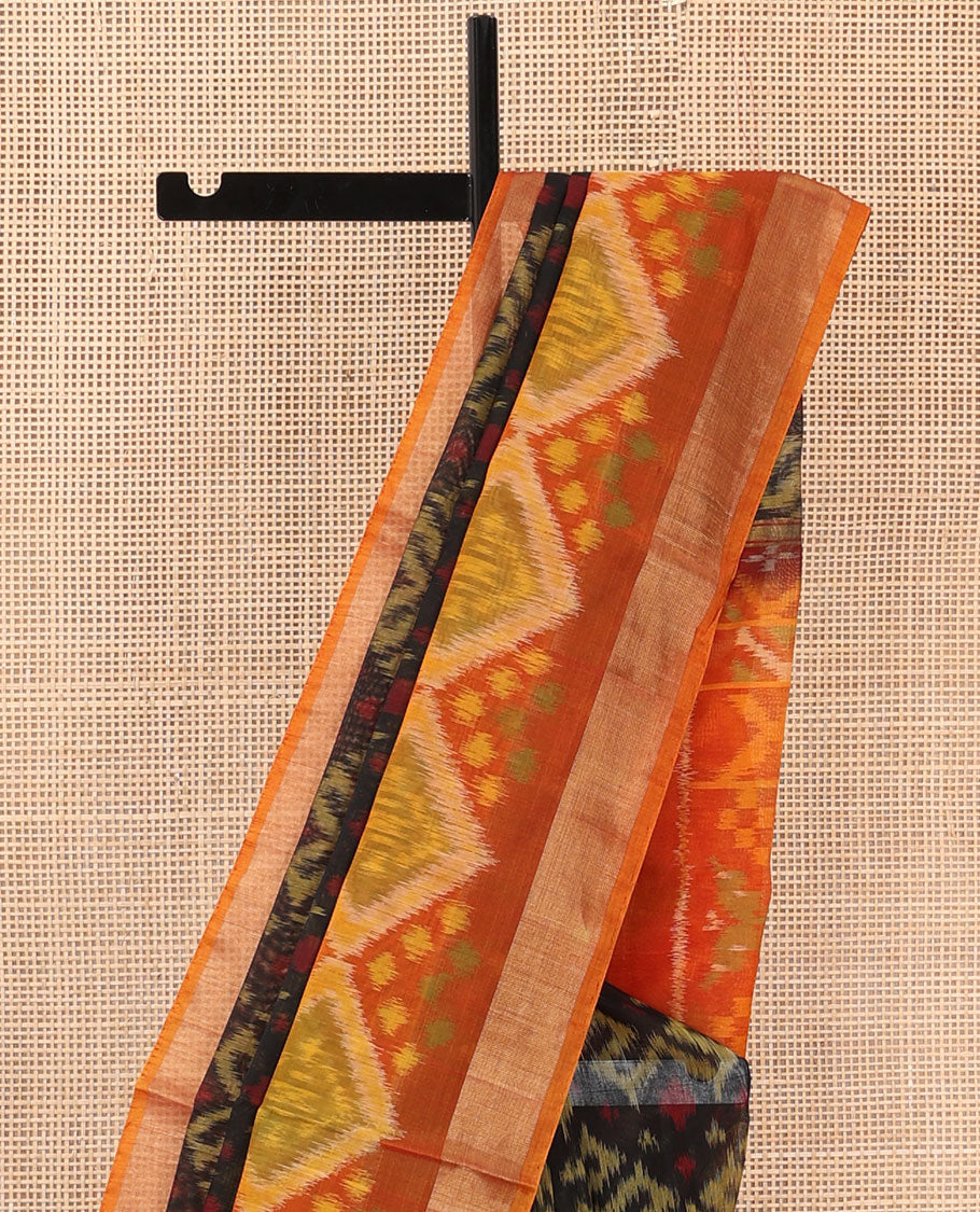 Black ikkat chevron design silk cotton saree, contrast diamond ikkat patterned border, and pallu of ikkat designs