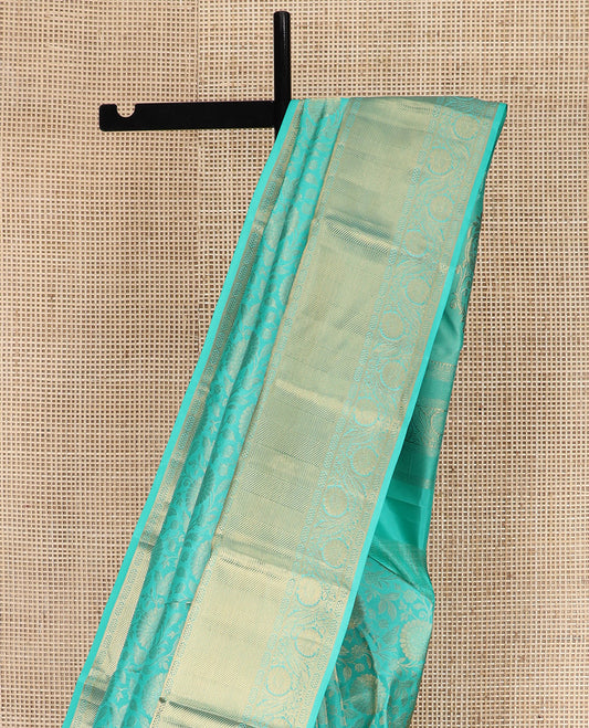 Blue Kanchipuram Wedding Silk Saree Delicately Woven with Floral Jaal Jacquard Designs, Highlighted with Zari Border of Vanki and Kodi Visiry Designs, Meticulously Detailed Pallu, and Paired with a Matching Blouse