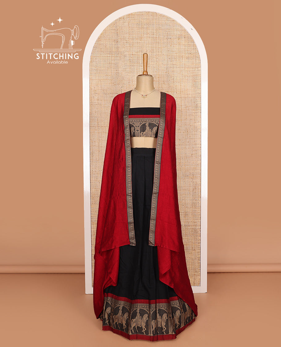 Black cotton half-saree, plain with contrast man on the horse motifs bordered skirt, matching blouse, and contrast dhavani
