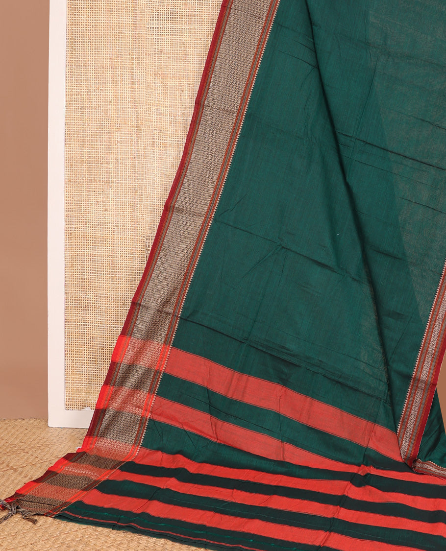 Dark green plain Narayanapet cotton saree, contrast geometric patterned thread border, and striped pallu