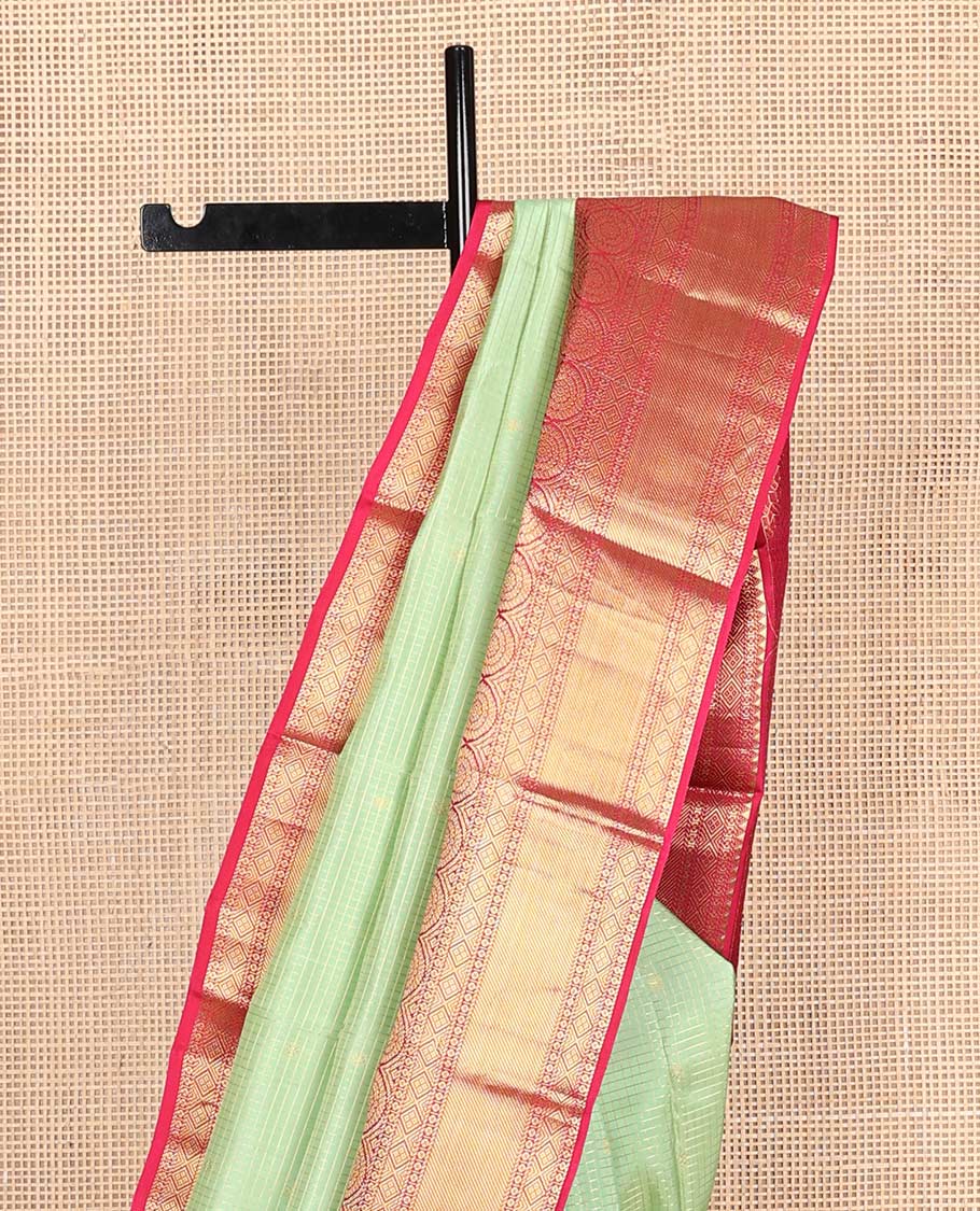 Pista green zari buttas & checked Vasundhara silk mix saree, contrast border of rekku,diamond & chakram designs & geometric patterned pallu