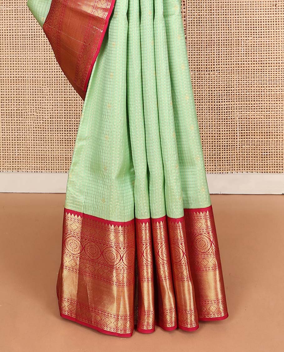 Pista green zari buttas & checked Vasundhara silk mix saree, contrast border of rekku,diamond & chakram designs & geometric patterned pallu