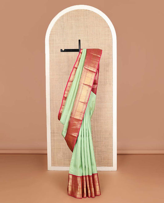 Pista green zari buttas & checked Vasundhara silk mix saree, contrast border of rekku,diamond & chakram designs & geometric patterned pallu
