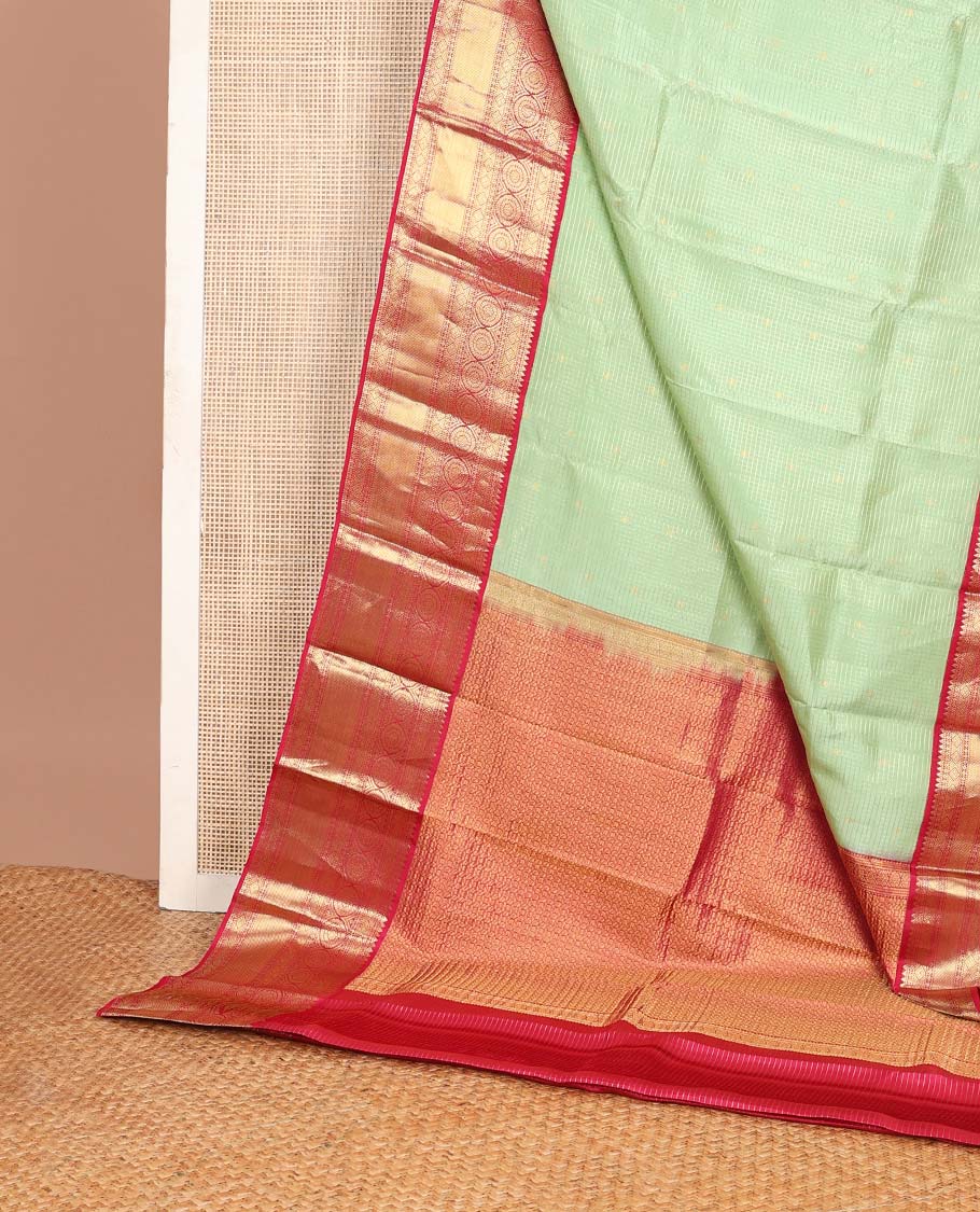 Pista green zari buttas & checked Vasundhara silk mix saree, contrast border of rekku,diamond & chakram designs & geometric patterned pallu