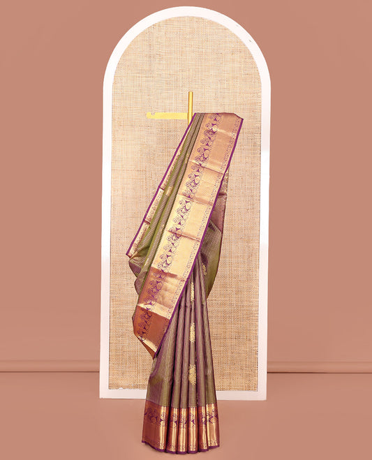 Green Vasundhara Silk Saree Elegantly Embellished with Floral Zari Buttas and Zari Checks, Highlighted by a Contrast Border of Traditional Zari Designs, Pallu Steeped with Manga and Kodi Vivsy Designs, and Paired with a Contrast Blouse