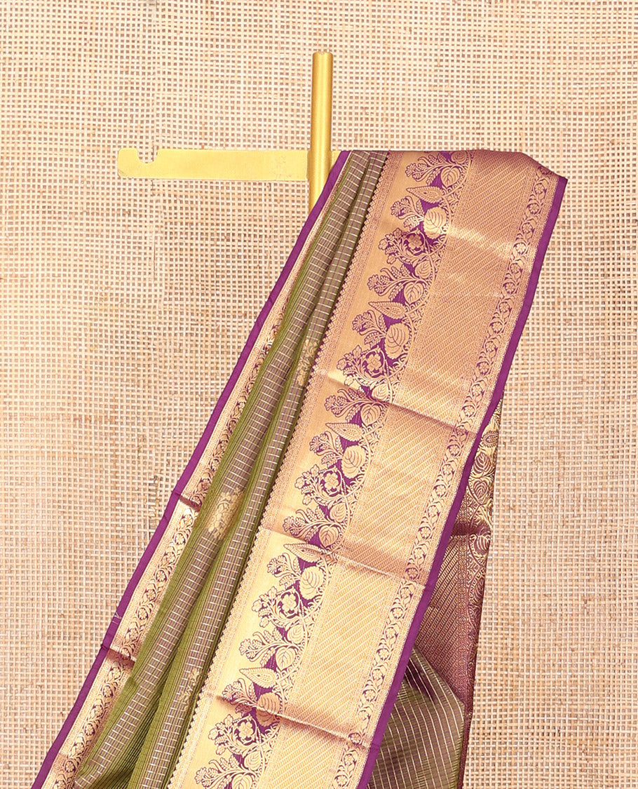 Green Vasundhara Silk Saree Elegantly Embellished with Floral Zari Buttas and Zari Checks, Highlighted by a Contrast Border of Traditional Zari Designs, Pallu Steeped with Manga and Kodi Vivsy Designs, and Paired with a Contrast Blouse