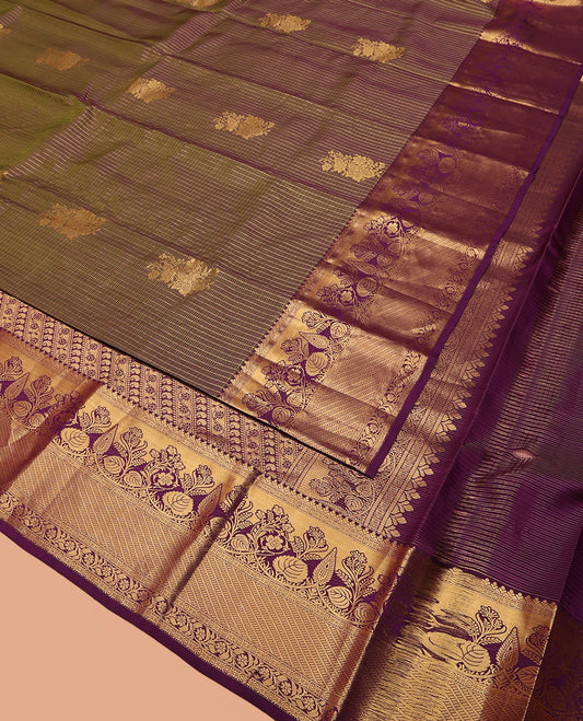 Green Vasundhara Silk Saree Elegantly Embellished with Floral Zari Buttas and Zari Checks, Highlighted by a Contrast Border of Traditional Zari Designs, Pallu Steeped with Manga and Kodi Vivsy Designs, and Paired with a Contrast Blouse