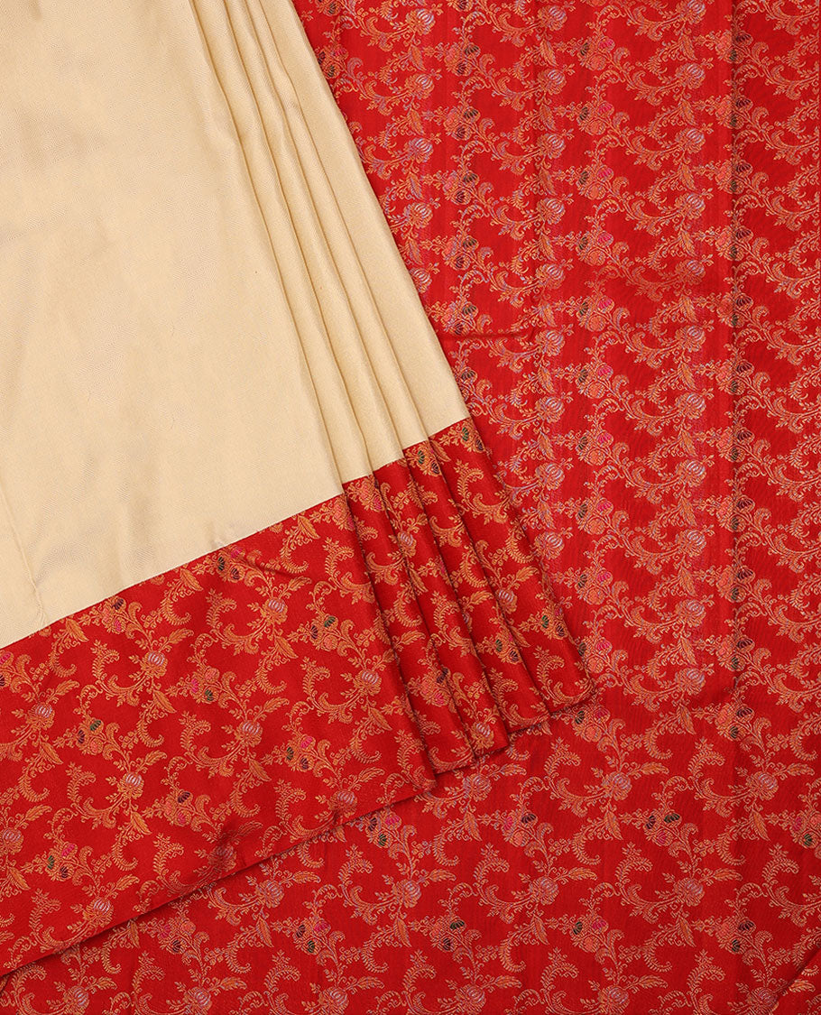 Cream embossed silk saree, contrast red border & pallu features meenakari resham thread woven floral jaal design