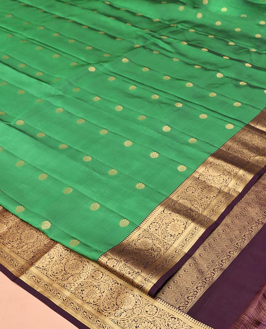 Green Vasundhara Lite Silk Mix Saree, Bedecked with Zari Buttas All Over Its Body, Complemented by Contrast Border of Kodi Visiry Designs, Grand Jaal Pallu and Paired with a Contrast Blouse