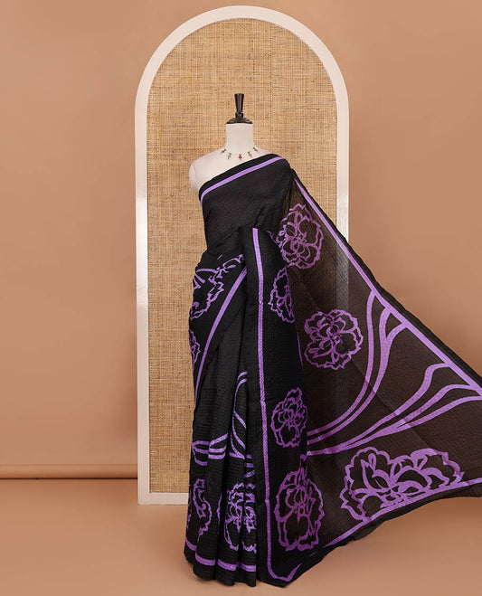 Black-base crushed litchi saree features fancy violet color floral printed body, printed piping border & pallu