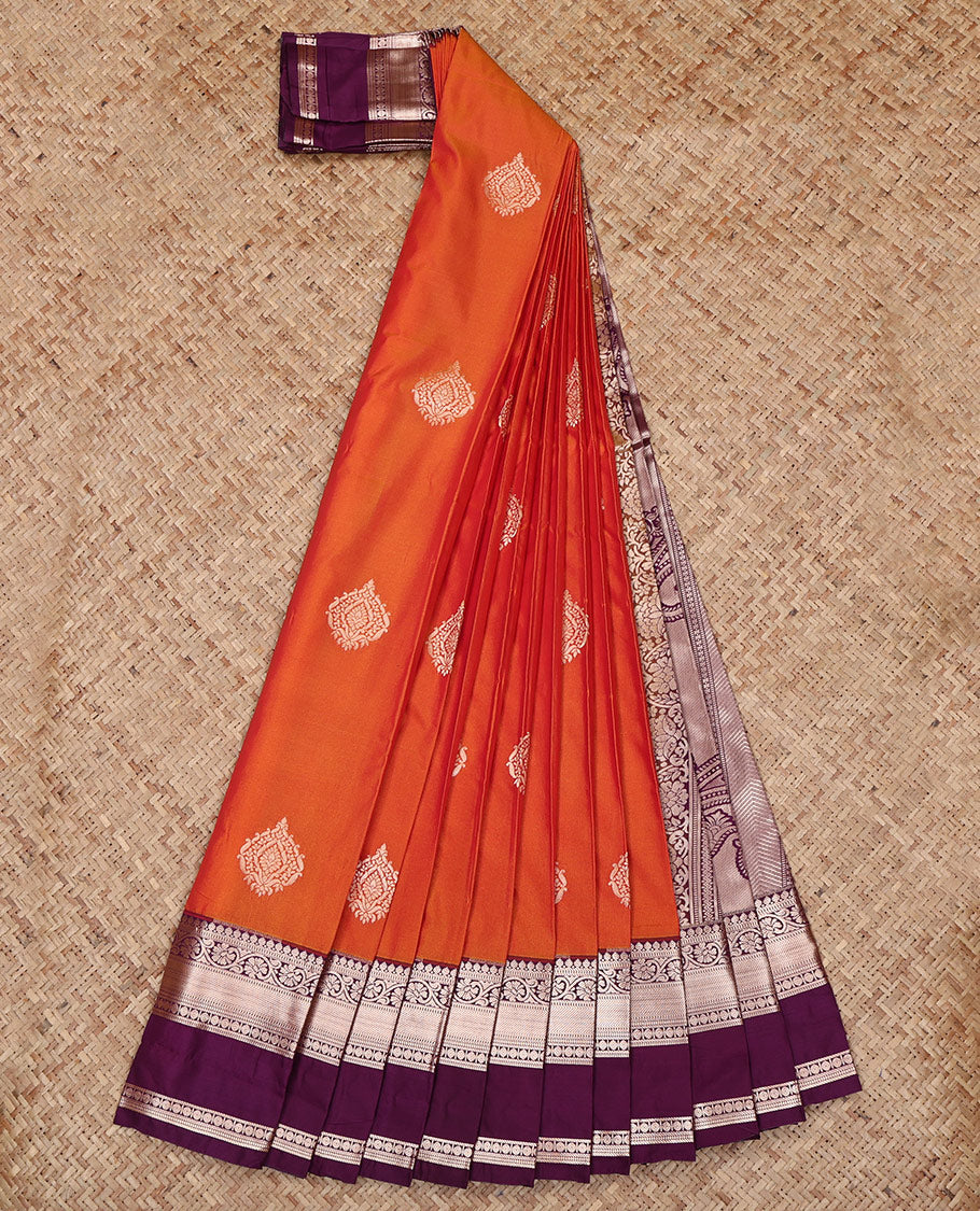 Orange Budget Silk Saree, Highlighted by Zari Buttas All Over Its Body, Complemented by a Contrast Traditional Zari Design Rettai Pettu Border, Intricately Designed Pallu, and Paired with a Contrast Blouse