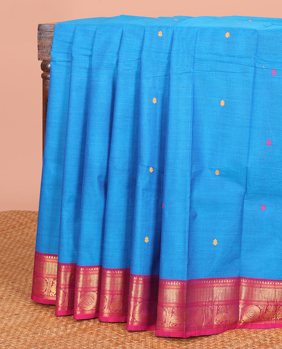 Blue Chettinad Cotton Saree Mesmerized with Thread Buttas All Over Its Body, Complemented by a Contrast Traditional Zari Motifs Woven Ganga Jamuna Border, and a Pallu of Stripes and Buttas