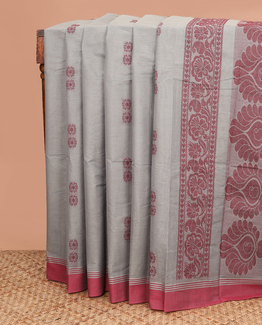 Orange floral buttas kanchi cotton saree, contrast border, and intricate pallu