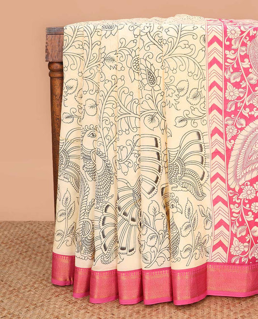 Light sandal flora-fauna motifs machine printed kalamkari cotton saree, contrast traditional zari blue border, and peacock printed pallu