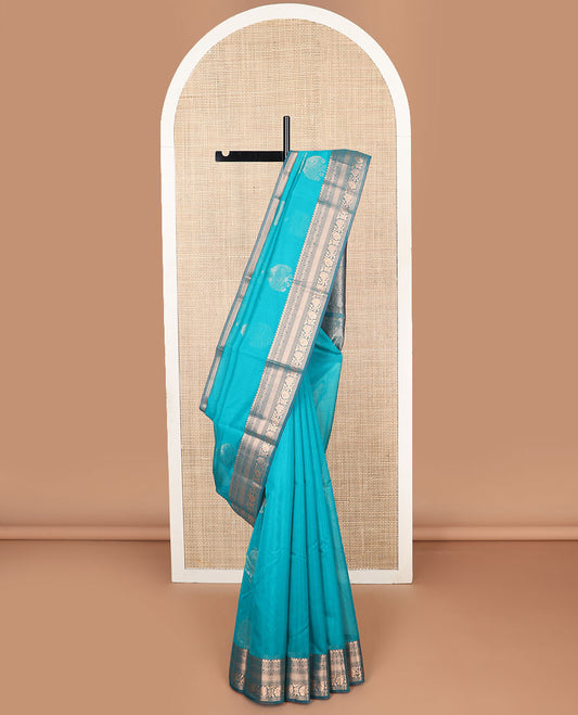 Blue motifs silk cotton saree with contrast floral design border & geometric design pallu
