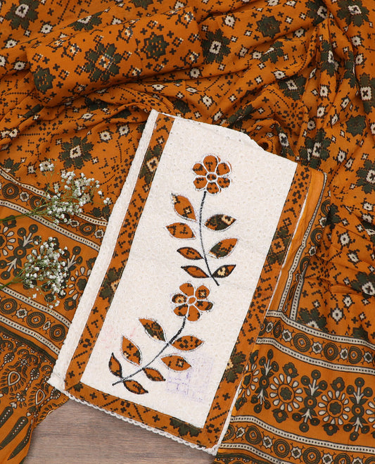 White material chudidar set, cut work with neck patch embroidered top, contrast patola printed bottom, and dupatta of patola print