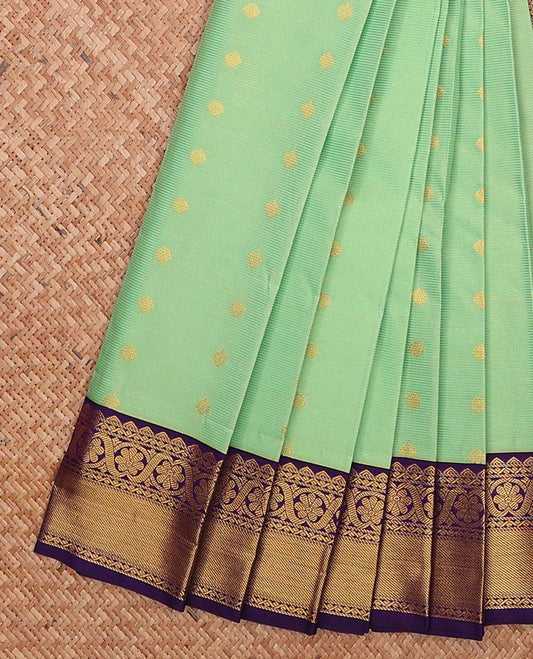 Green zari buttas gift saree, contrast traditional zari border, and jaal pallu