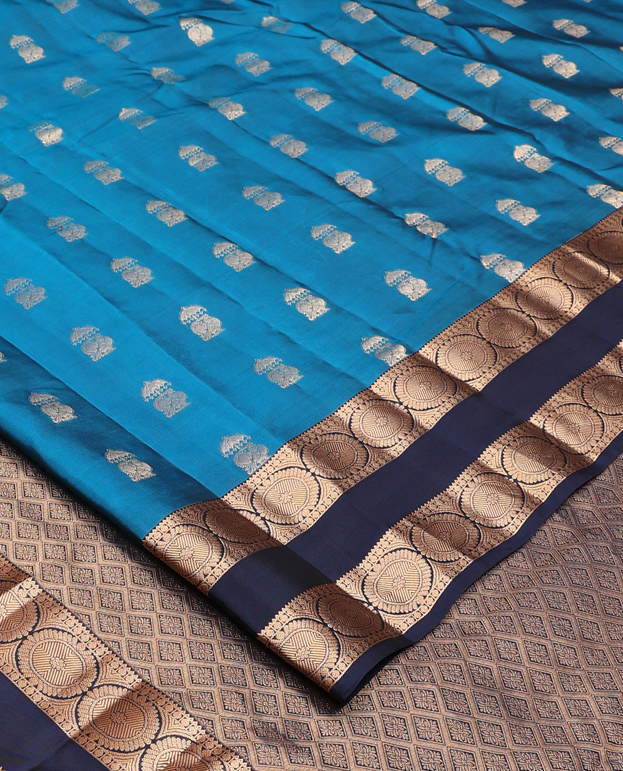 Blue zari buttas Vasundhara silk mix saree, contrast rettai pettu border of rekku, poun, and chakram motifs, and jaal pallu