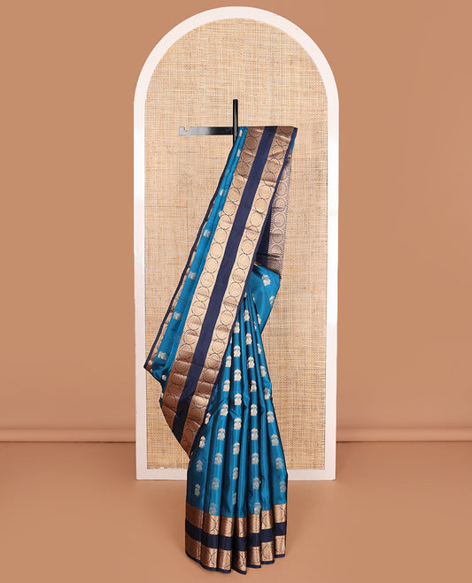 Blue zari buttas Vasundhara silk mix saree, contrast rettai pettu border of rekku, poun, and chakram motifs, and jaal pallu