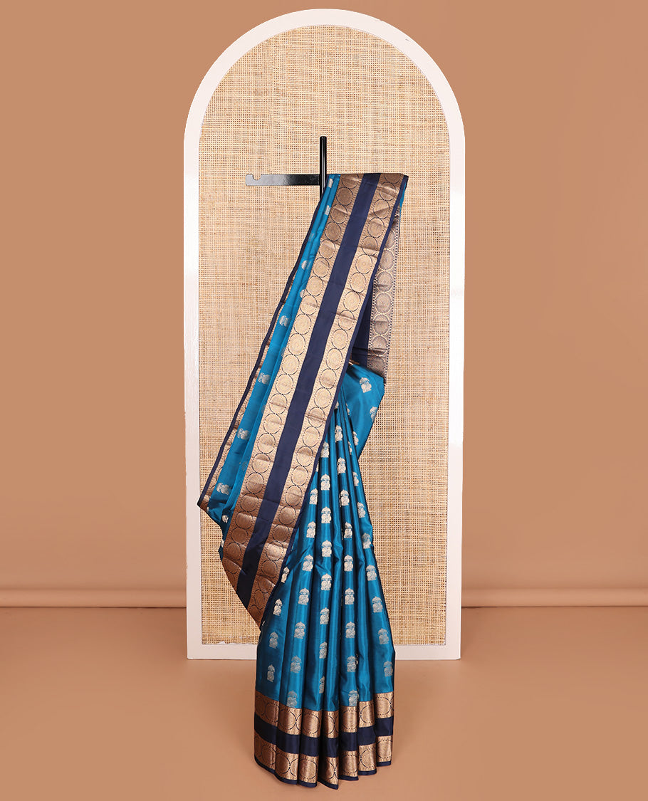 Blue zari buttas Vasundhara silk mix saree, contrast rettai pettu border of rekku, poun, and chakram motifs, and jaal pallu