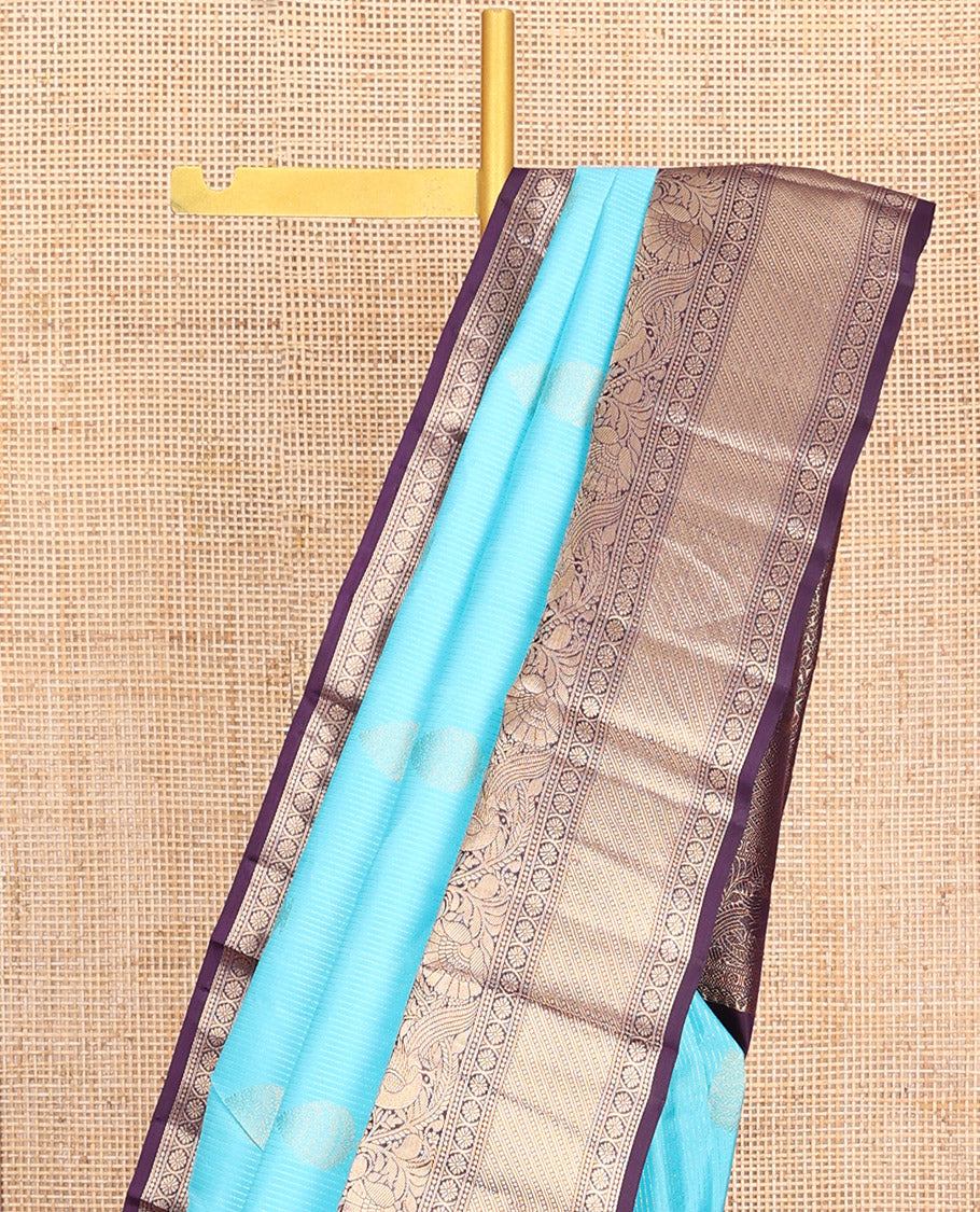 Blue Vasundhara Silk Saree, Richly Detailed with Stripes and Zari Buttas, Complemented by a Contrast Border of Thilakam Mokku, Laddu Kamalam, and Kodi Visiry and Mayil Designs, Mughal-Style Designed Pallu, and Paired with a Contrast Blouse