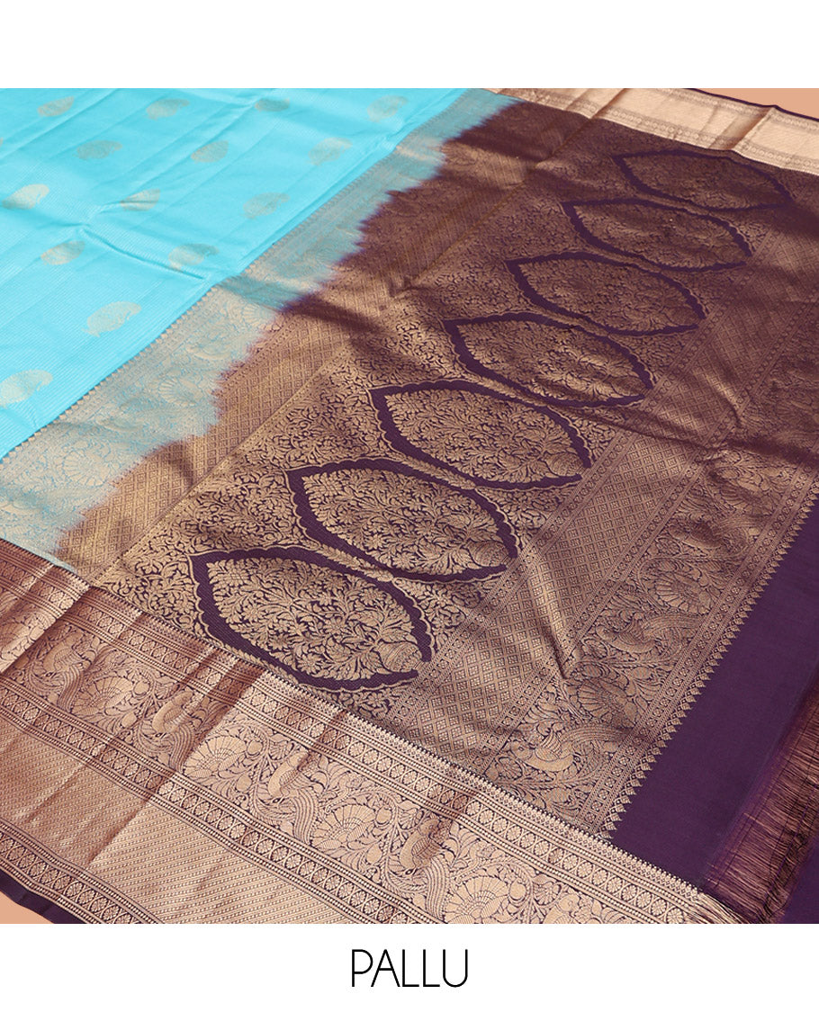 Blue Vasundhara Silk Saree, Richly Detailed with Stripes and Zari Buttas, Complemented by a Contrast Border of Thilakam Mokku, Laddu Kamalam, and Kodi Visiry and Mayil Designs, Mughal-Style Designed Pallu, and Paired with a Contrast Blouse