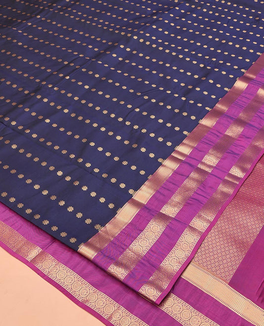 Blue Vasundhara Lite Silk Mix Saree, Delicately Woven with Zari Buttas All Over Its Body, Complemented by Contrast Rettai Pettu Border of Vanki, Muthu, Neli, and Chakram Designs, Grandly Decked Up Pallu and Paired with a Contrast Blouse