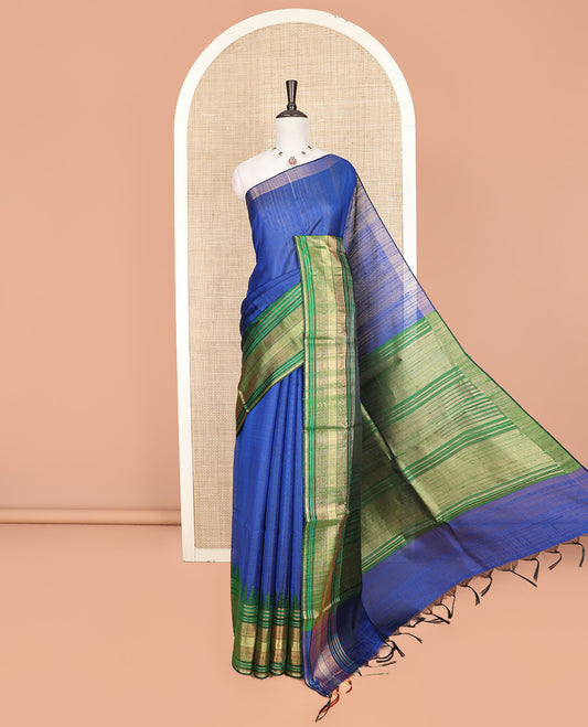 Royal Blue Plain Dupion Silk Saree, Elevated with a One-Sided Contrast Temple Border, Pallu Steeped with Zari Temple Designs, and Paired with a Contrast Blouse